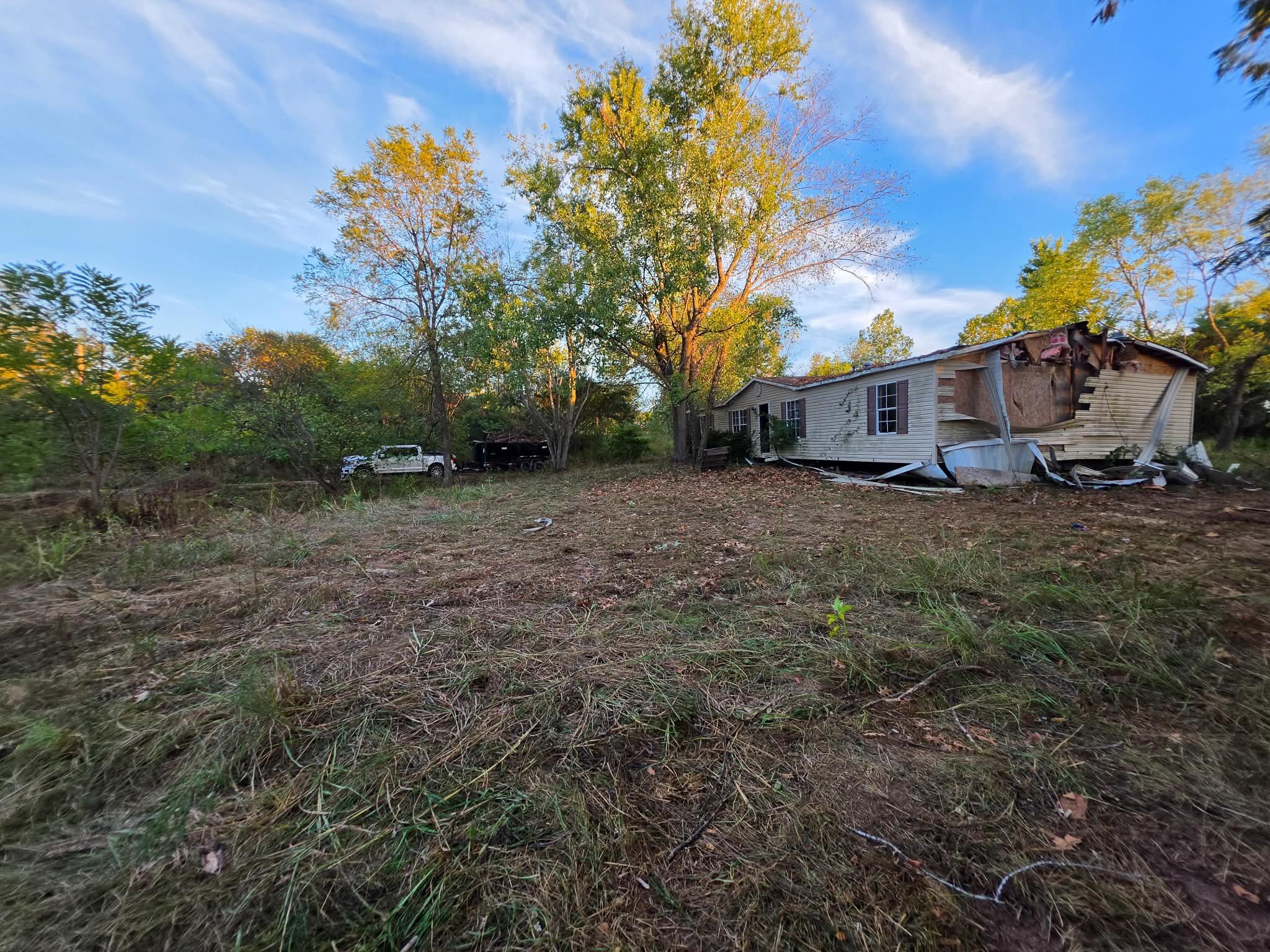 Storm-damaged tree and cleanup work at a residential property